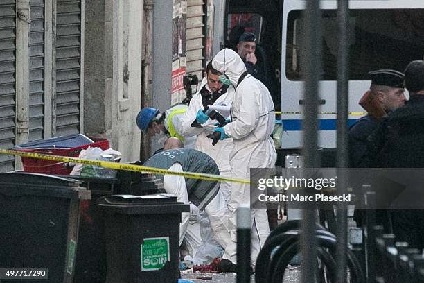 Forensics of the french police are seen in front of the '8, Rue du Corbillon' on November 18, 2015 in Saint-Denis, France. French Police special...