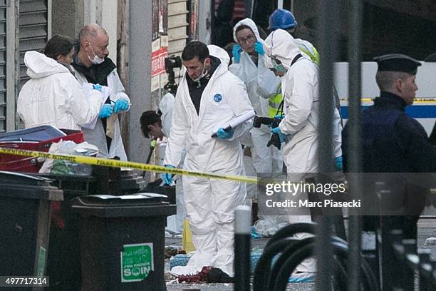 Forensics of the french police are seen in front of the '8, Rue du Corbillon' on November 18, 2015 in Saint-Denis, France. French Police special...
