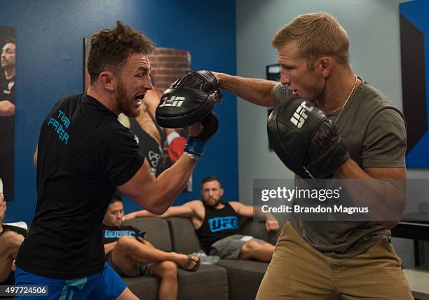 James Jenkins warms up with TJ Dillashaw before facing Artem Lobov during the filming of The Ultimate Fighter: Team McGregor vs Team Faber at the UFC...