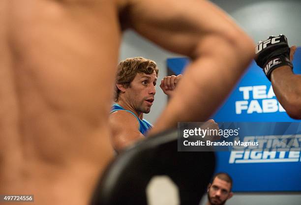 Head coach Urijah Faber helps Johnny Nunez warm up before facing David Teymur during the filming of The Ultimate Fighter: Team McGregor vs Team Faber...