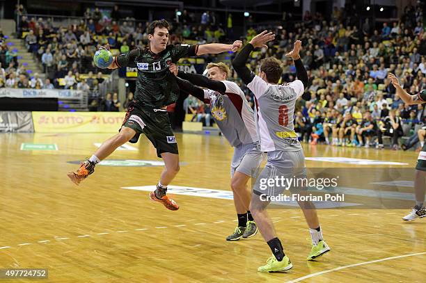 Petar Nenadic of Fuechse Berlin throws the ball against Benjamin Herth of TuS N-Luebbecke during the game between the Fuechse Berlin and dem TuS...