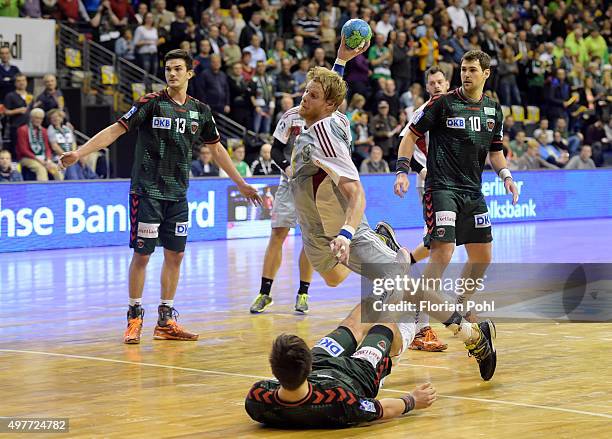 Christian Klimek of TuS N-Luebbecke throws the ball during the game between the Fuechse Berlin and dem TuS N-Luebbecke on november 18, 2015 in...