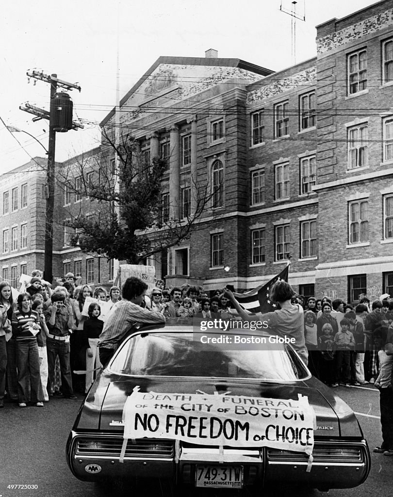 Boston Busing Riot Flag An anti-busing motorcade stops outside South Boston High School on ...