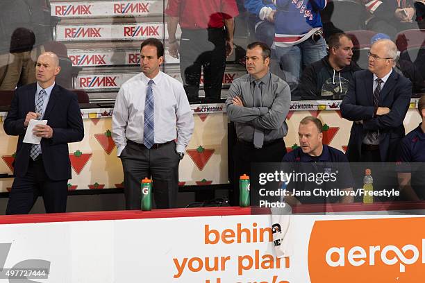 Assistant coach Darryl Williams , associate coach Scott Arniel , head coach Alain Vigneault and assistant Coach and goaltending coach Benoit Allaire...