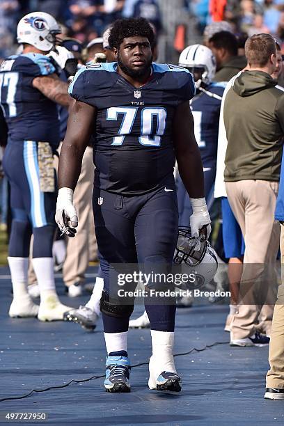 Chance Warmack of the Tennessee Titans watches from the sideline during a game against the Carolina Panthers at Nissan Stadium on November 15, 2015...