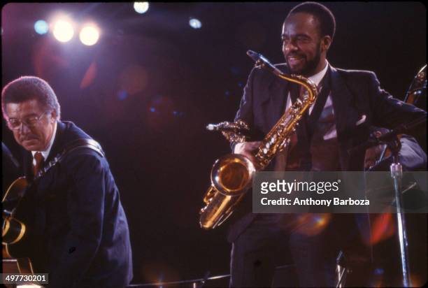 From left, American jazz musicians Kenny Burrell, on guitar, and Grover Washington Jr , on saxophone, perform on stage during the 'One Night With...