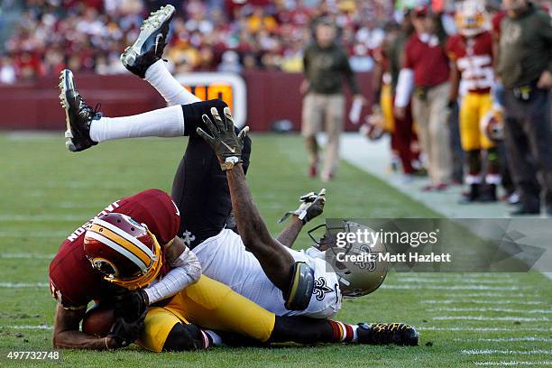 Cornerback Keenan Lewis of the New Orleans Saints collides with wide receiver DeSean Jackson of the Washington Redskins in the second quarter at...