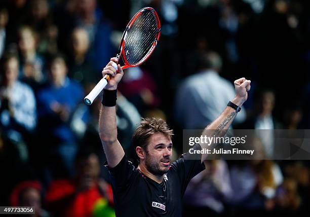 Stan Wawrinka of Switzerland celebrates victory in his men's singles match against David Ferrer of Spain during day four of the Barclays ATP World...