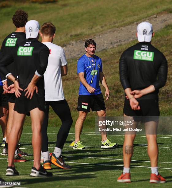 Magpies assistant coach Robert Harvey speaks to players during a Collingwood Magpies AFL pre-season training camp at Falls Creek on November 19, 2015...