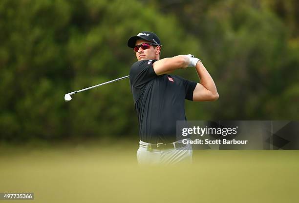 Adam Scott of Australia plays an approach shot on the 17th hole during day one of the 2015 Australian Masters at Huntingdale Golf Course on November...