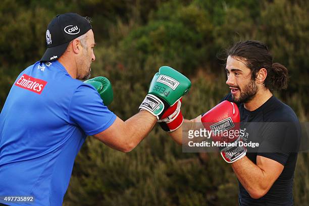 Brodie Grundy boxes with the assistant coach Anthony Rocca in the circuit session during a Collingwood Magpies AFL pre-season training camp at Falls...