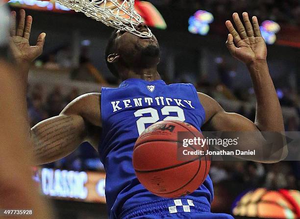 Alex Poythress of the Kentucky Wildcats gets his teeth caught in the net while dunknig against the Duke Blue Devils during the Champions Classic at...