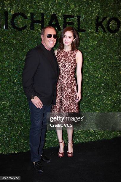 Designer Michael Kors and actress Yang Mi attend the opening reception of Michael Kors' new store on November 18, 2015 in Beijing, China.