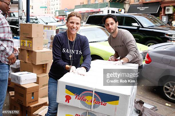 Gina Matthews and Seth Fisher of "Saints & Strangers" volunteer at The Food Bank Of NYC Community Kitchen as part of National Geographic Channel and...