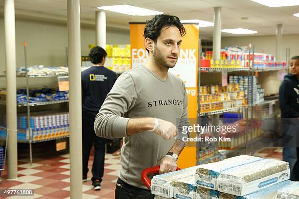 Seth Fisher of "Saints & Strangers" volunteer at The Food Bank Of NYC Community Kitchen as part of National Geographic Channel and Feeding America's...