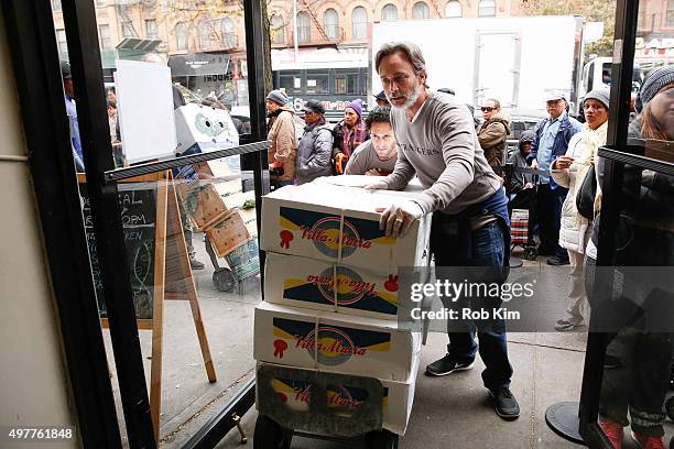 Grant Scharbo and Seth Fisher of "Saints & Strangers" volunteer at The Food Bank Of NYC Community Kitchen as part of National Geographic Channel and...