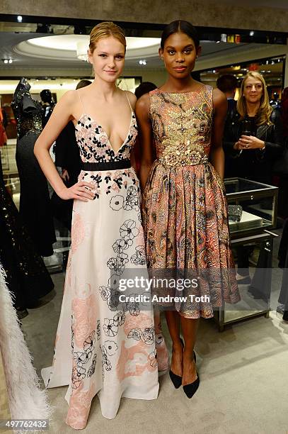 Models pose during "Badgley Mischka: American Glamour" book celebration at Bergdorf Goodman on November 18, 2015 in New York City.