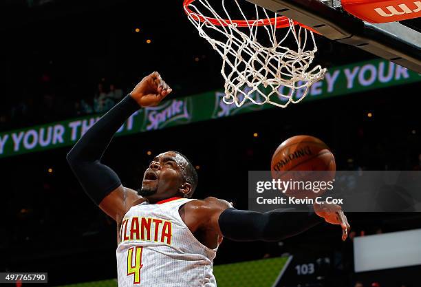 Paul Millsap of the Atlanta Hawks dunks against the Sacramento Kings at Philips Arena on November 18, 2015 in Atlanta, Georgia. NOTE TO USER User...