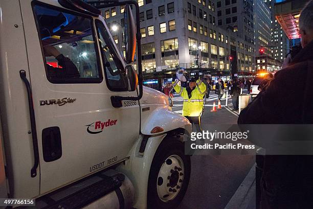Police officer directs a truck to pull into place for inspection by K-9 officers outside Grand Central Terminal. Following the release of a new video...