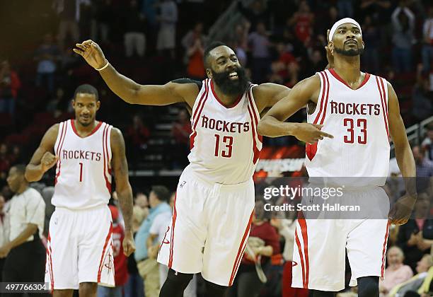James Harden and Corey Brewer of the Houston Rockets celebrate after Brewer hit a three-point shot near the end of the fourth quarter against the...