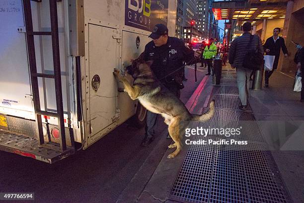 Officer and his dog inspect a truck randomly flagged for inspection on Lexington Avenue, outside Grand Central Terminal. Following the release of a...