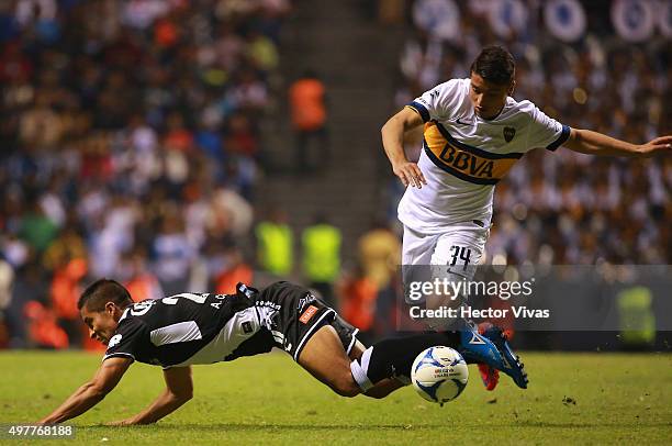 Sebastian Palacios of Boca Juniors struggles for the ball with Adrian Cortes of Puebla during the friendly match between Puebla and Boca Juniors at...