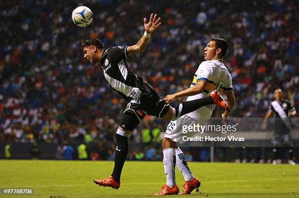 Andres Chavez of Boca Juniors fights for the ball with Ramon Arias of Puebla during the friendly match between Puebla and Boca Juniors at Cuauhtemoc...