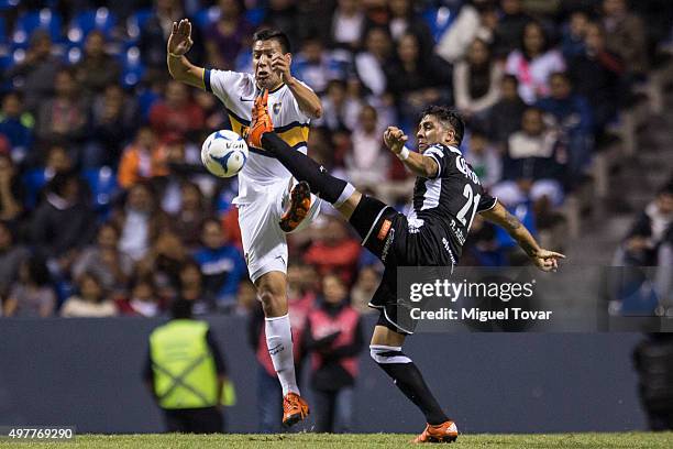 Ramon Arias of Puebla struggles for the ball with Andres Chavez of Boca Juniors during the opening friendly match between Puebla and Boca Juniors at...