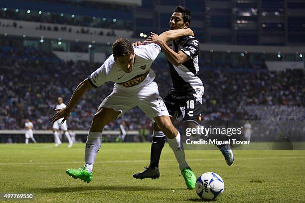 David Toledo of Puebla fights for the ball with Lisandro Magallan of Boca Juniors during the opening friendly match between Puebla and Boca Juniors...