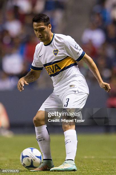 Fabian Monzon of Boca Juniors passes the ball during the opening friendly match between Puebla and Boca Juniors at Cuauhtemoc Stadium on November 18,...