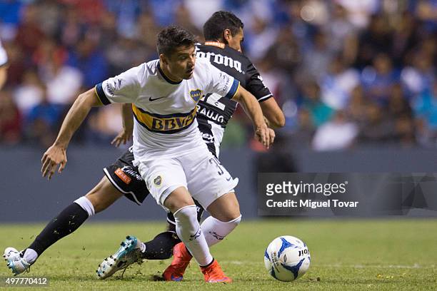 Patricio Araujo of Puebla fights for the ball with Sebastian Palacios of Boca Juniors during the opening friendly match between Puebla and Boca...