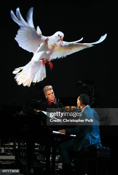 Recording artists P!nk and John Legend perform onstage at A+E Networks "Shining A Light" concert at The Shrine Auditorium on November 18, 2015 in Los...