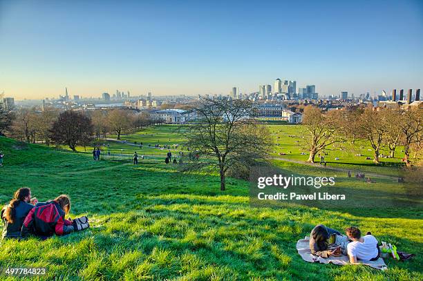 london skyline seen at sunset from greenwich park. - greenwich london stock-fotos und bilder