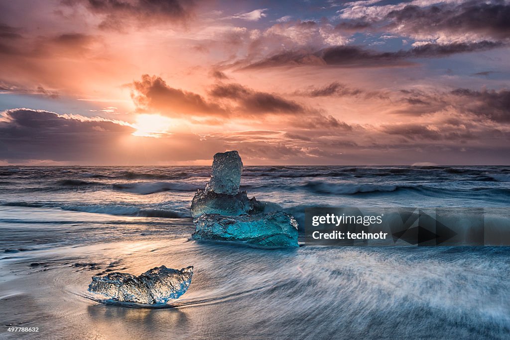 Icebergs Floating on Icy Beach at Sunrise, South Iceland
