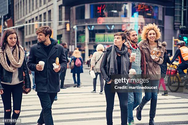 group of people crossing the street in new york. - times square manhattan bildbanksfoton och bilder