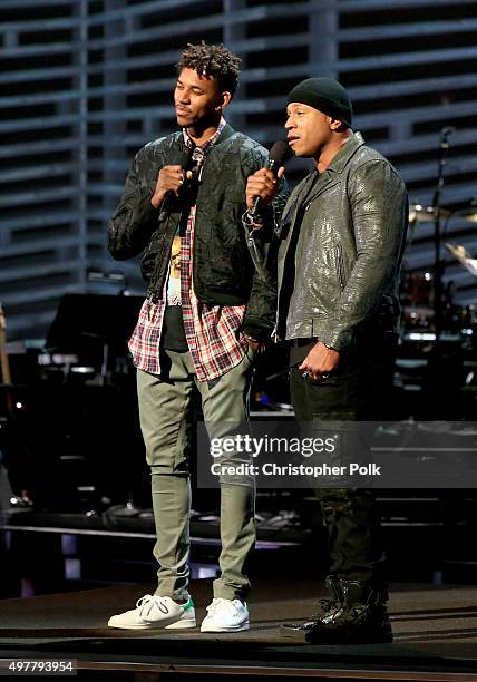 Basketball player Nick Young and LL Cool J speak onstage at A+E Networks "Shining A Light" concert at The Shrine Auditorium on November 18, 2015 in...