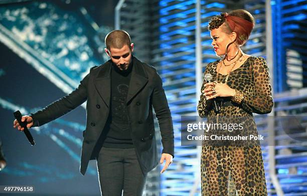 Recording artists Nick Jonas and Andra Day perform onstage at A+E Networks "Shining A Light" concert at The Shrine Auditorium on November 18, 2015 in...