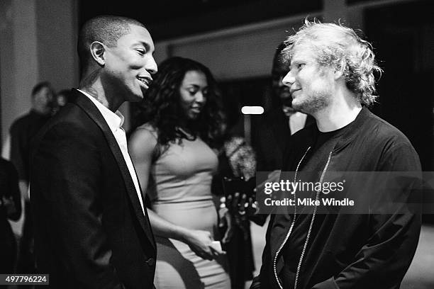 Recording artists Pharrell Williams and Ed Sheeran attend A+E Networks 'Shining A Light' concert at The Shrine Auditorium on November 18, 2015 in Los...