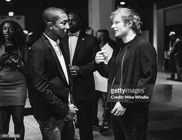 Recording artists Pharrell Williams and Ed Sheeran attend A+E Networks 'Shining A Light' concert at The Shrine Auditorium on November 18, 2015 in Los...