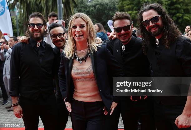 Gin Wigmore poses for photos with her band after they arrive at the Vodafone New Zealand Music Awards at Vector Arena on November 19, 2015 in...
