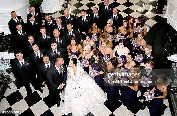 Jenni 'JWoww' Farley and Roger Mathews pose for wedding pictures along with the entire bridal party at the wedding of television personalities Jenni...