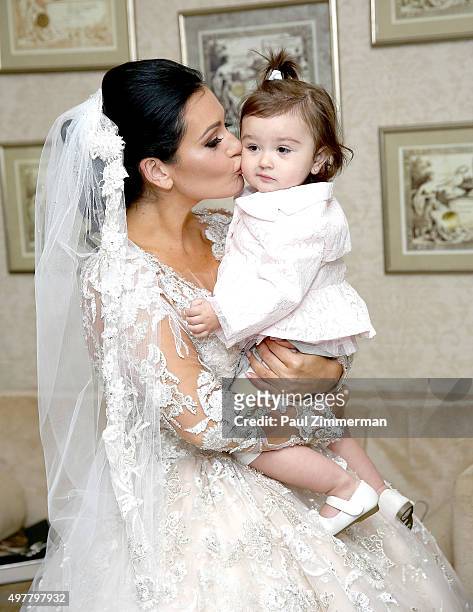 Jenni 'JWoww' Farley and daughter Meilani Alexandra Mathews pose for wedding pictures at the wedding of television personalities Jenni 'JWoww' Farley...