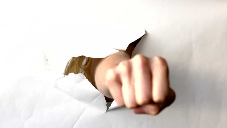 Exploding Through Paper Bust Through Paper Videos and HD Footage - Getty Images