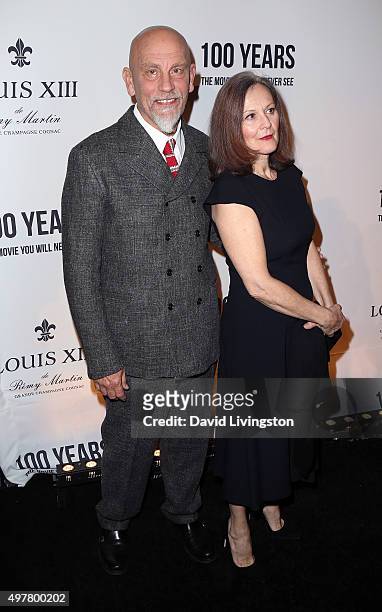Actor John Malkovich and Nicoletta Peyran attend LOUIS XIII toasts to "100 Years: The Movie You Will Never See" at the Sheats Goldstein residence on...