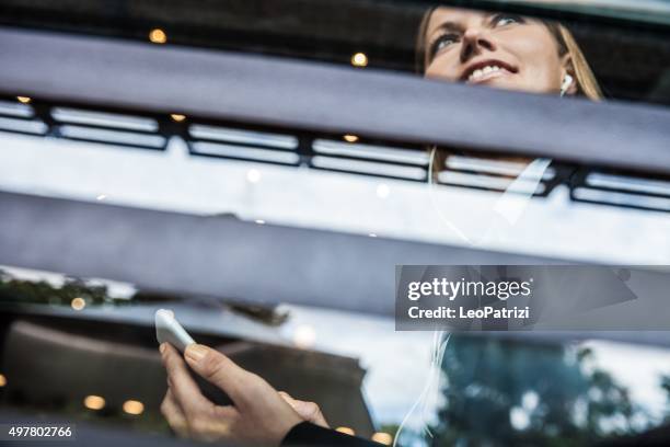 business woman on the window of a cafe - morning commute stock pictures, royalty-free photos & images