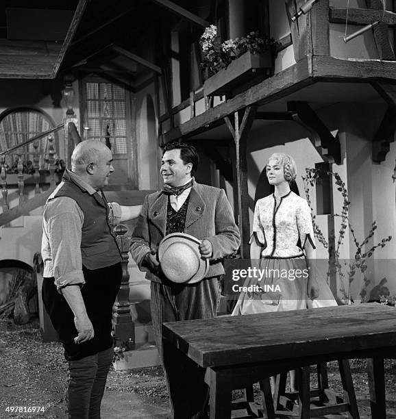 Raoul Marco, Michel Galabru and Marie Versini in a scene of the play "Friend Fritz" realized by Georges Folgoas