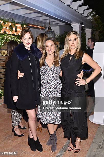 Actress Dakota Johnson, designer Jennifer Meyer and actress Jennifer Aniston attend Barneys New York, Jennifer Aniston, and Tobey Maguire host a...