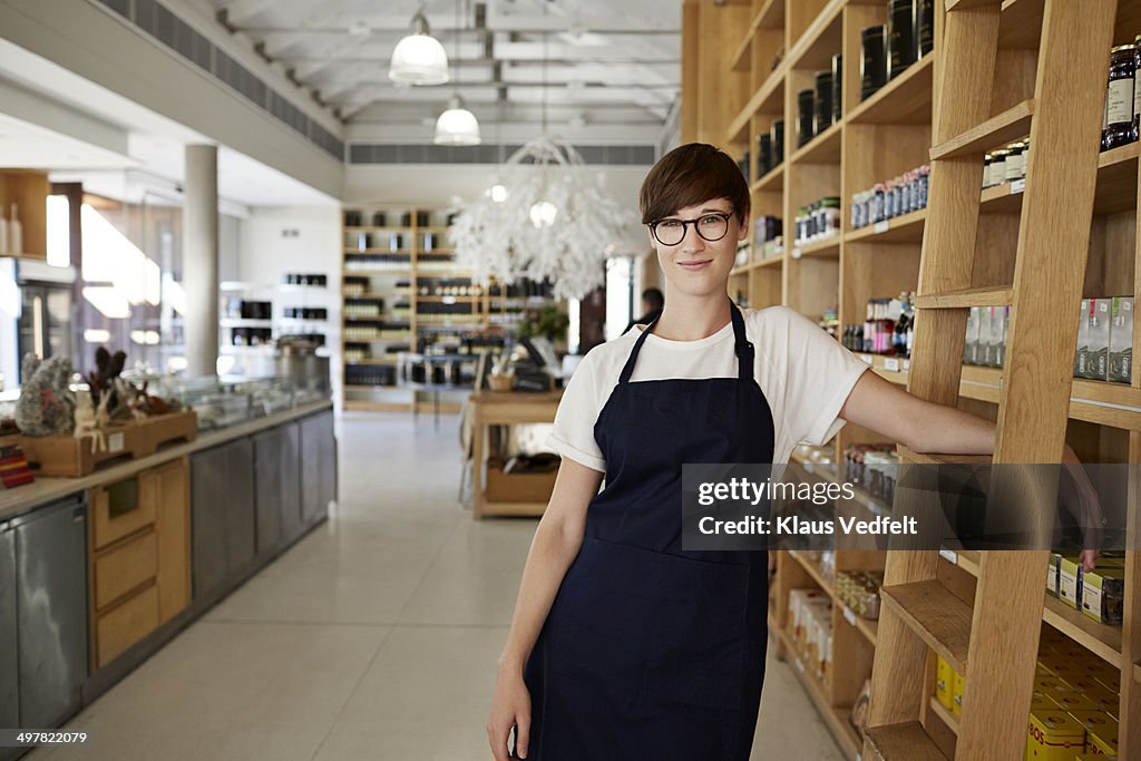 Portrait of cool female deli shop clerk