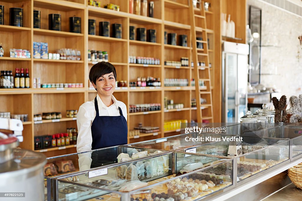 Portrait of cute clerk in deli shop