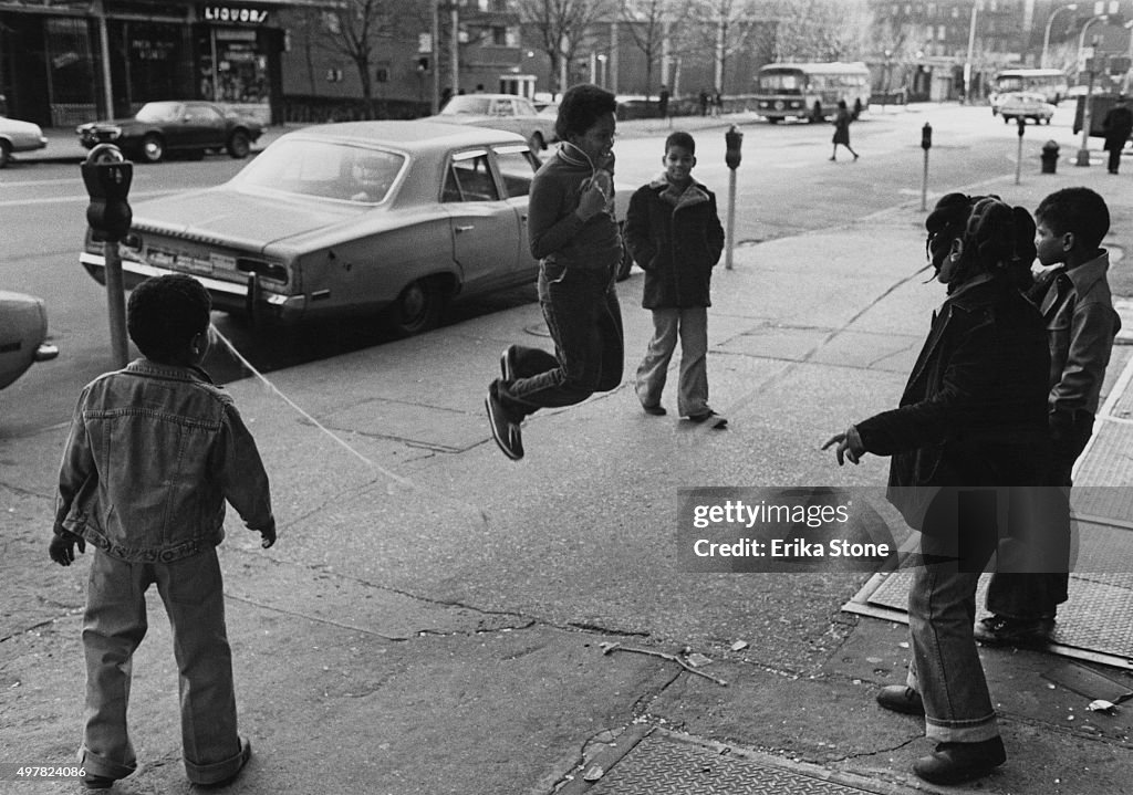Jump Rope Cities Children playing jump-rope in a street in Harlem, New York City ...